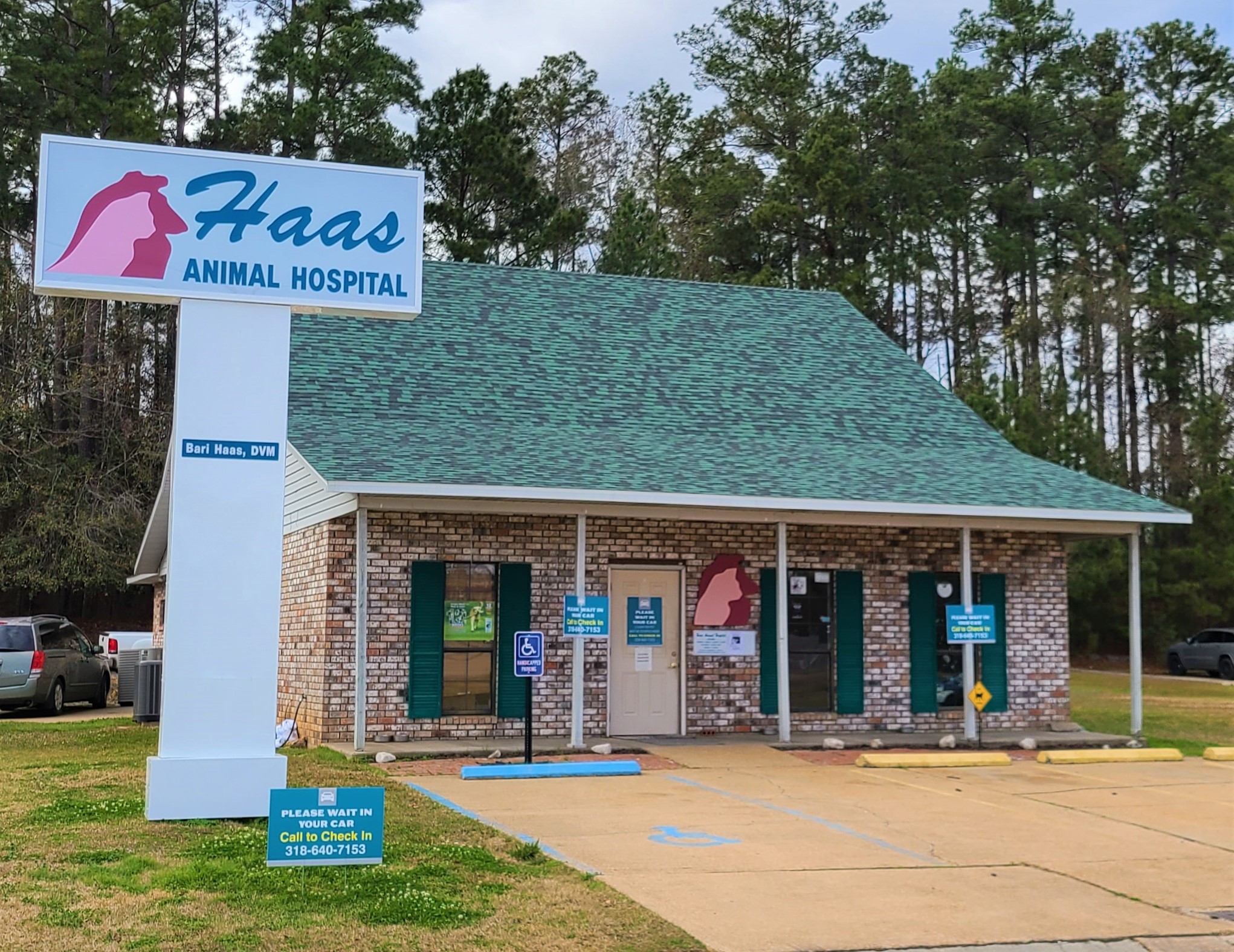 Haas Animal Hospital Building with a sign